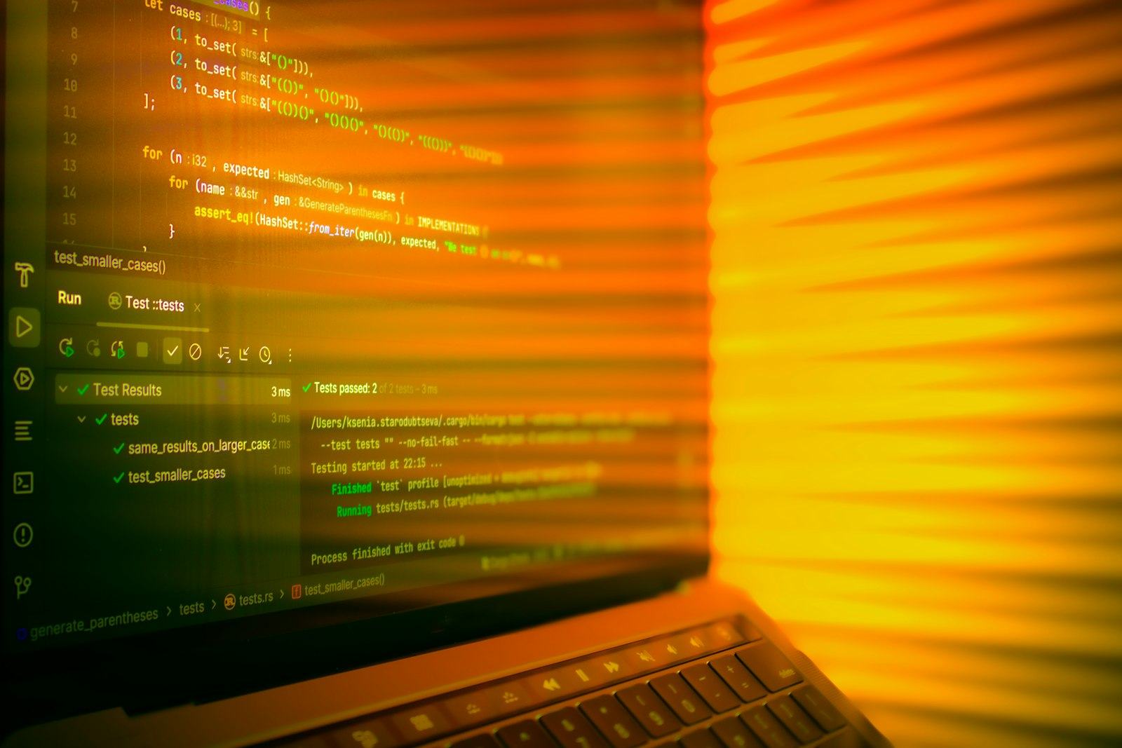 A laptop screen glowing in a dark room