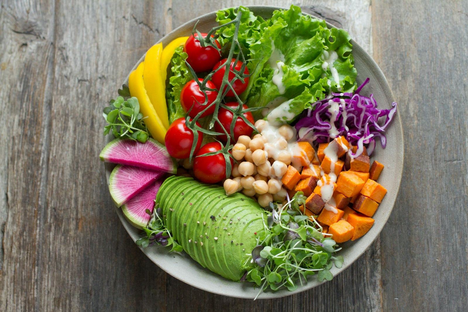 An overhead shot of a fresh vegetable bowl