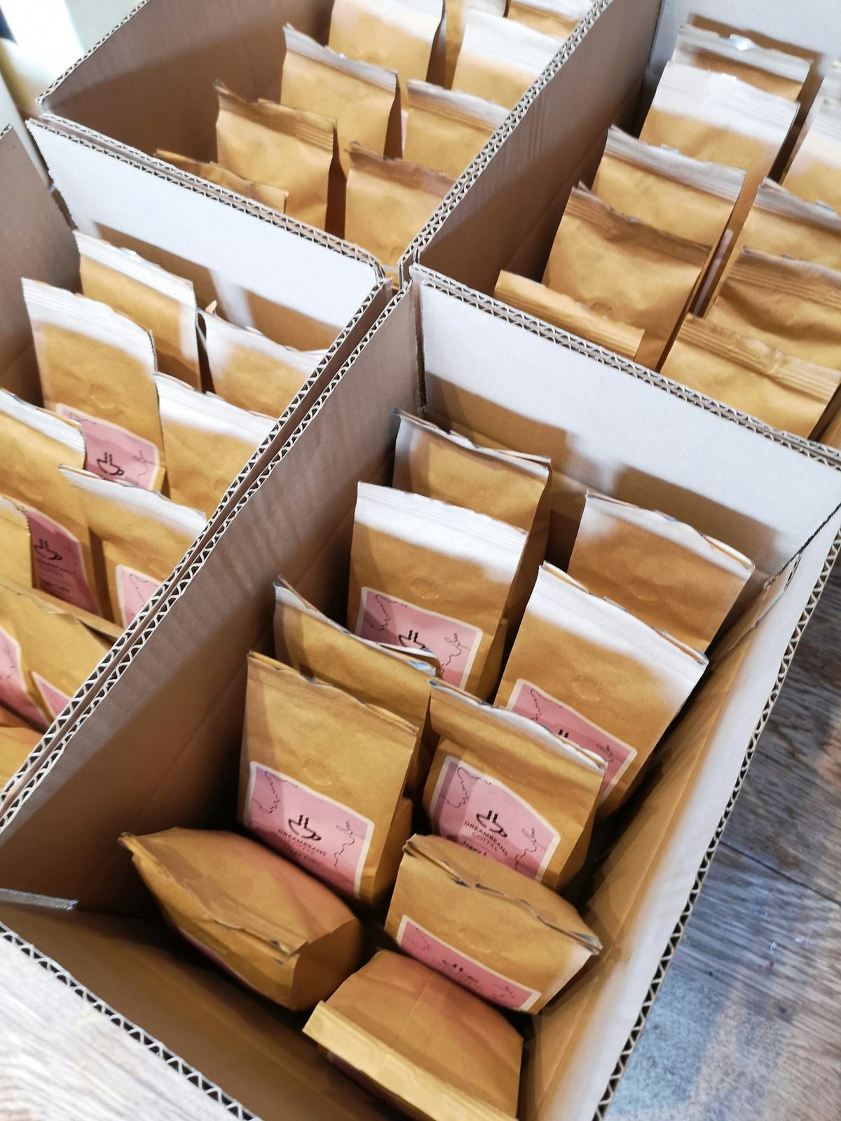 A large pile of plain cardboard shipping boxes